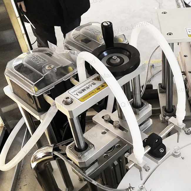 Vial filling and capping machine with peristaltic pump metering system Vial filling and capping machine with peristaltic pump metering system