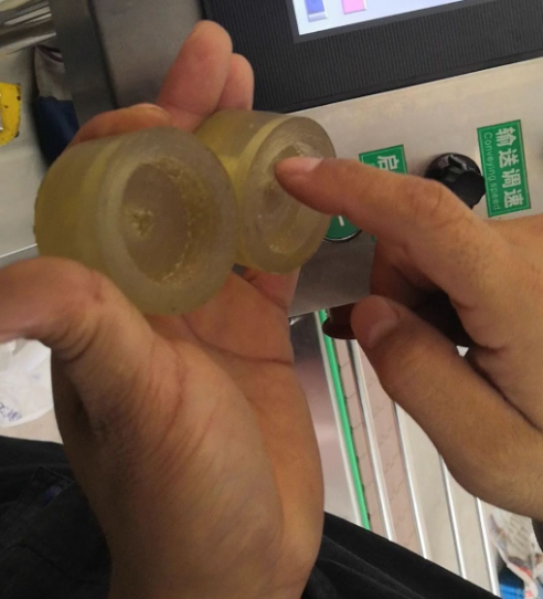 Vial filling and capping machine with peristaltic pump metering system