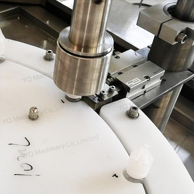 Vial filling and capping machine with peristaltic pump metering system