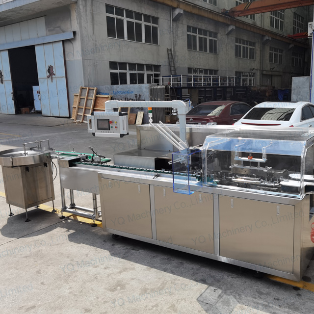 Bottle Cartoning Machine With Pack On Table And Dropping System