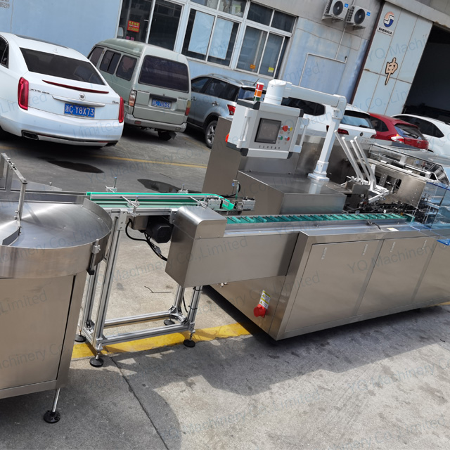 Bottle Cartoning Machine With Pack On Table And Dropping System